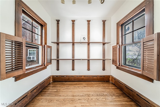 unfurnished sunroom featuring cooling unit