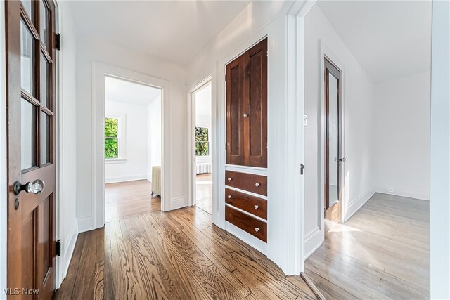 hallway with light wood-type flooring