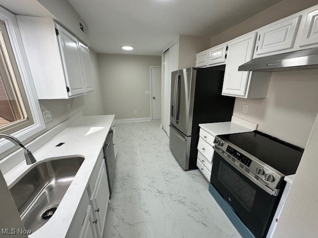 kitchen with stainless steel appliances, sink, and white cabinets