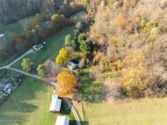 birds eye view of property with a rural view