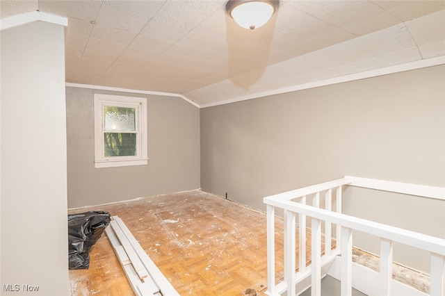 bonus room with parquet floors and vaulted ceiling