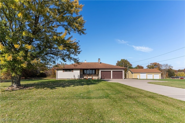 single story home featuring a front yard and a garage