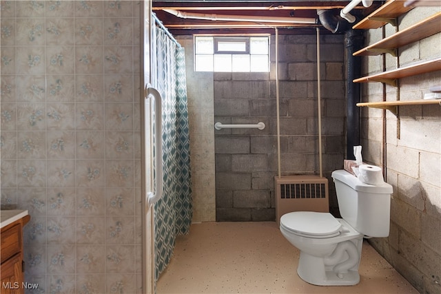 bathroom with vanity, toilet, walk in shower, and radiator heating unit