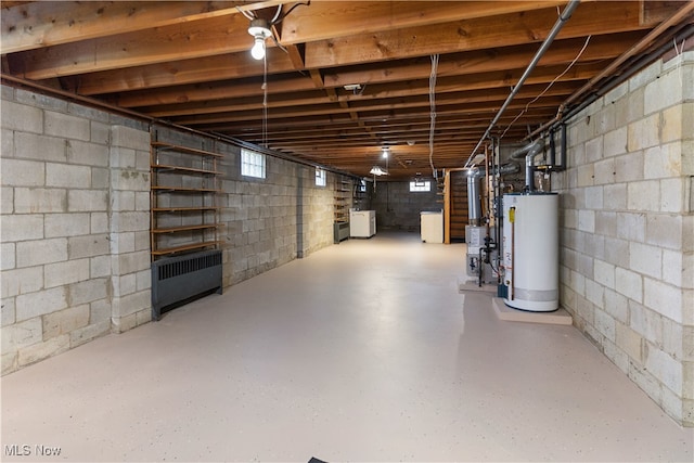 basement with washer / dryer and water heater