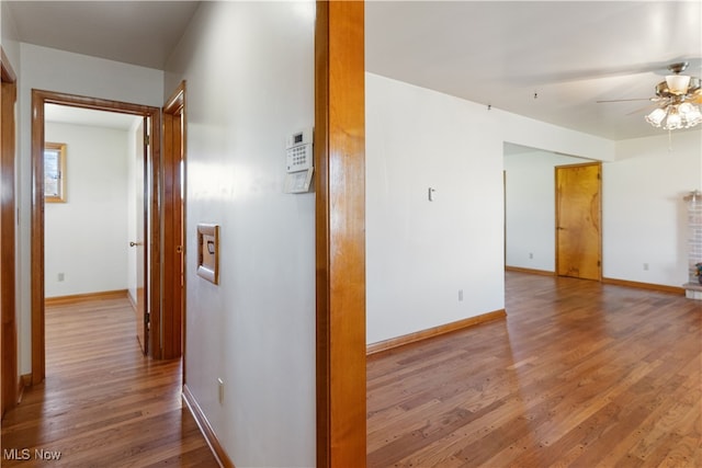 corridor featuring hardwood / wood-style flooring