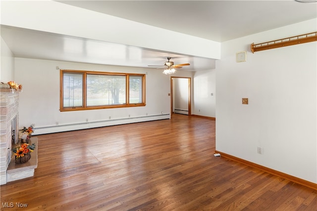 unfurnished living room with a baseboard radiator, a fireplace, and dark hardwood / wood-style floors