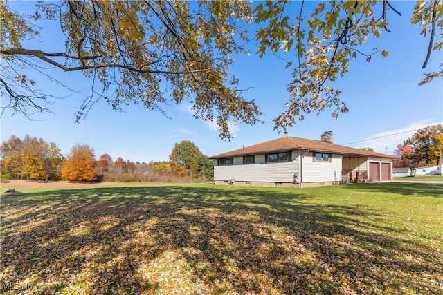 view of yard featuring a garage