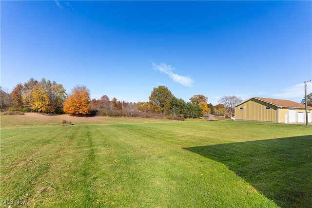 view of yard with a garage