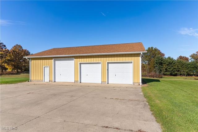 garage featuring a yard