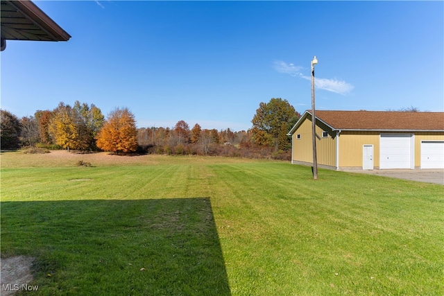 view of yard featuring a garage