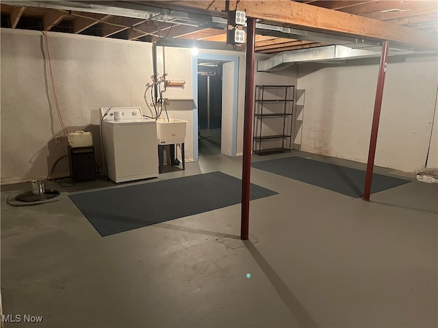 basement with washer / dryer and sink