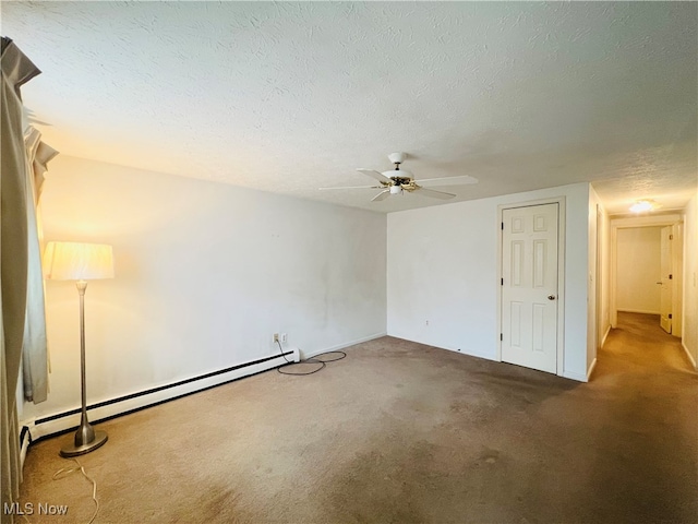 spare room featuring carpet, a textured ceiling, a baseboard radiator, and ceiling fan