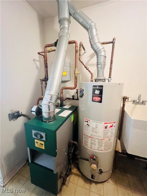 utilities featuring sink and water heater