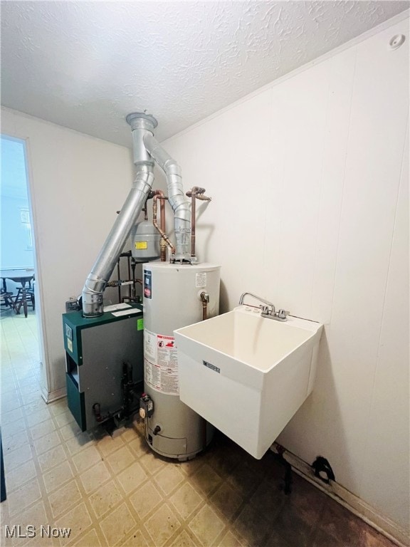 utility room with sink and water heater