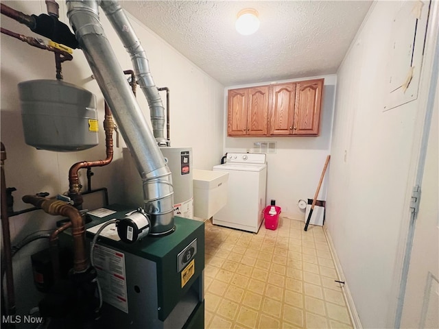 laundry room with sink, a textured ceiling, water heater, washer and clothes dryer, and cabinets