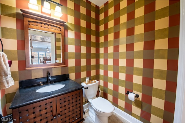 bathroom with vanity and toilet