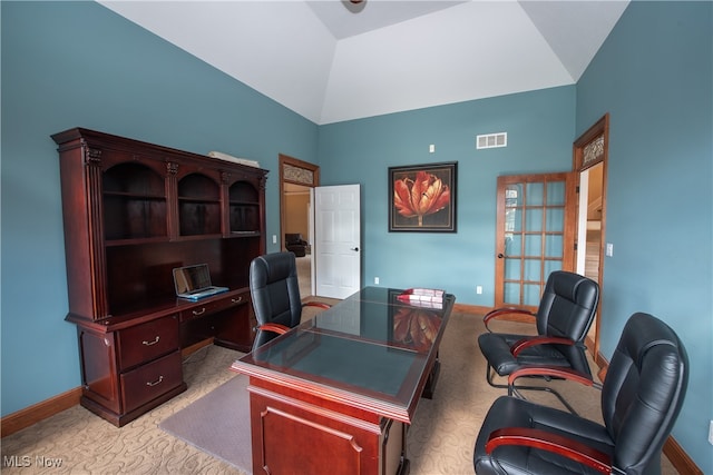 carpeted office with high vaulted ceiling