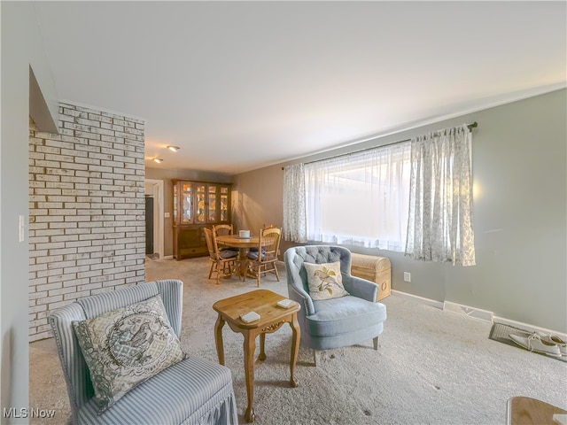 living area featuring light colored carpet