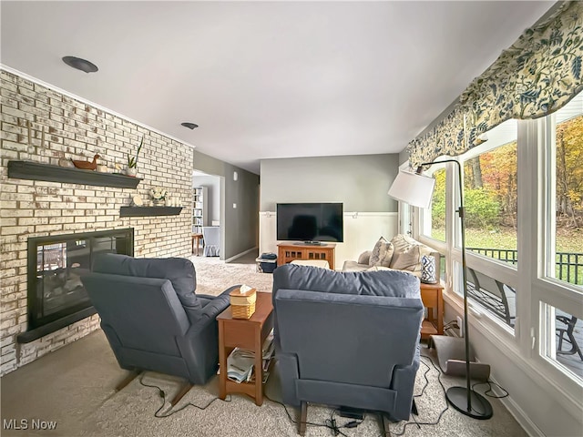 living room with carpet floors and a brick fireplace