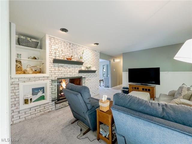 carpeted living room featuring a fireplace