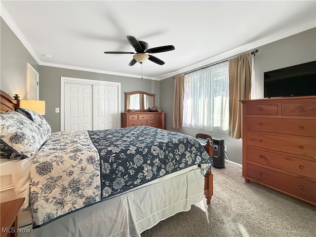 bedroom with a closet, light colored carpet, ceiling fan, and ornamental molding