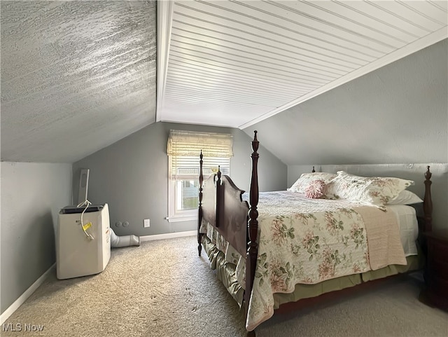 carpeted bedroom with lofted ceiling