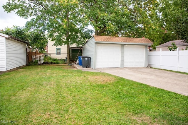 view of yard with a garage and an outdoor structure