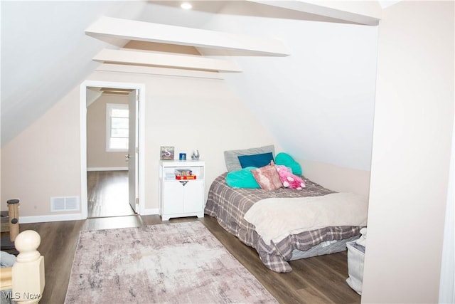 bedroom featuring wood-type flooring and lofted ceiling