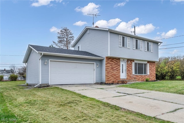 view of property featuring a front lawn and a garage