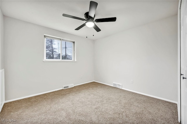 unfurnished room featuring carpet flooring and ceiling fan