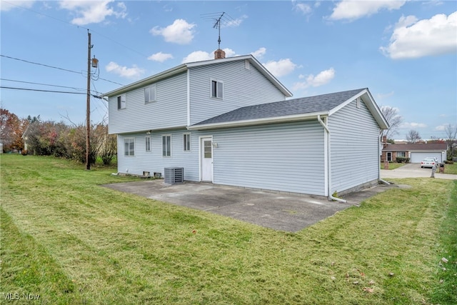 back of property featuring a yard, a patio area, and central AC unit