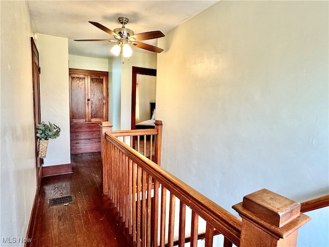 corridor featuring dark hardwood / wood-style floors