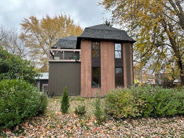 view of home's exterior featuring a shed