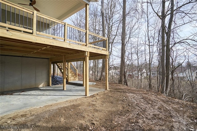 exterior space with ceiling fan and a wooden deck