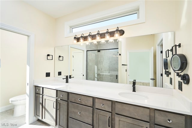 bathroom featuring walk in shower, tile patterned flooring, vanity, and toilet