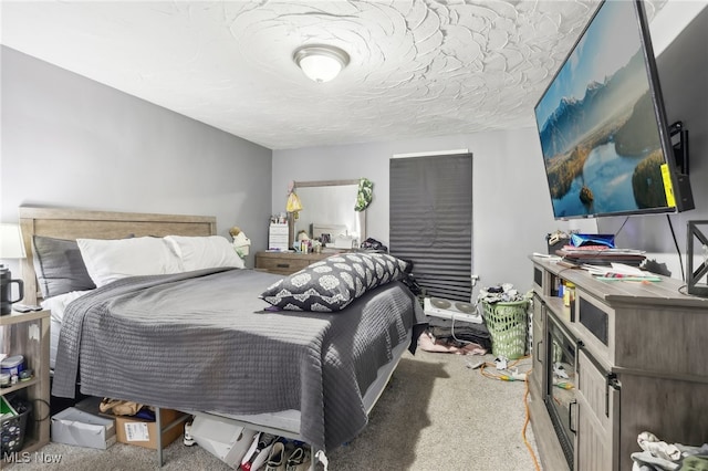 carpeted bedroom with a textured ceiling