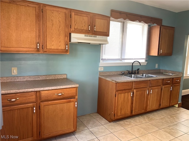 kitchen with sink and light tile patterned floors