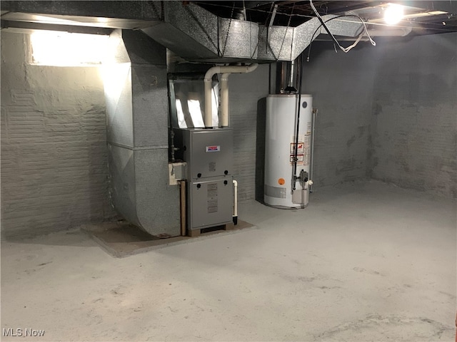 utility room featuring water heater and heating unit