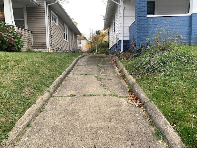 view of side of property with a yard