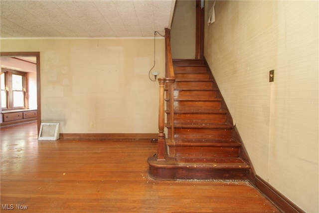 stairway with wood-type flooring