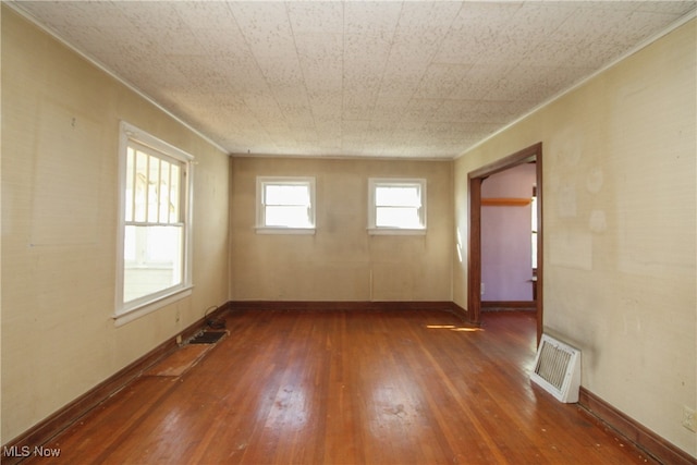 unfurnished room featuring dark hardwood / wood-style flooring