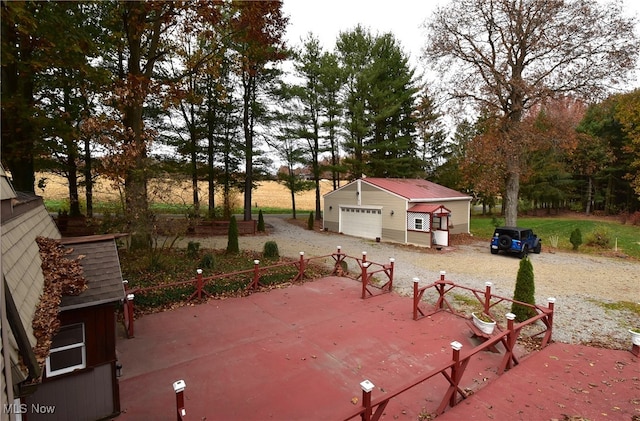 view of patio featuring an outdoor structure and a garage