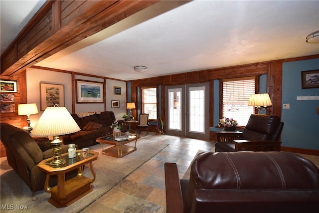 living room featuring french doors and crown molding