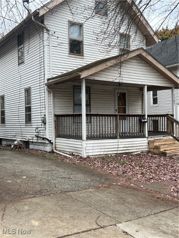 rear view of house with a porch