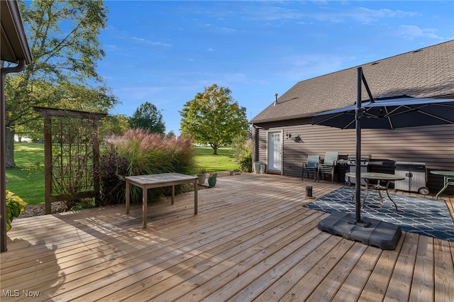 wooden deck with a hot tub