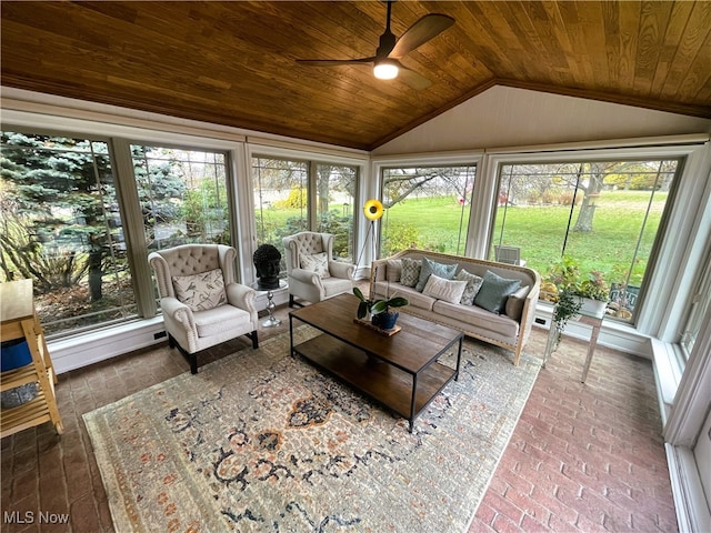 sunroom featuring vaulted ceiling, a wealth of natural light, wooden ceiling, and ceiling fan