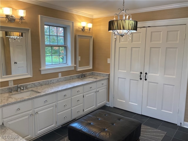 bathroom featuring crown molding, tile patterned flooring, and vanity