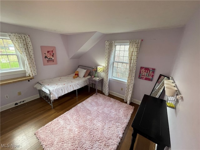 bedroom with hardwood / wood-style flooring