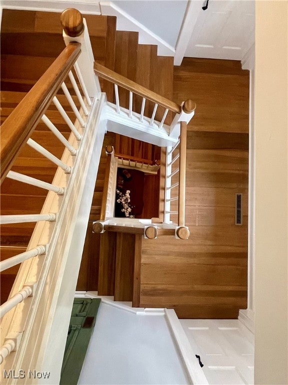 staircase with wooden walls