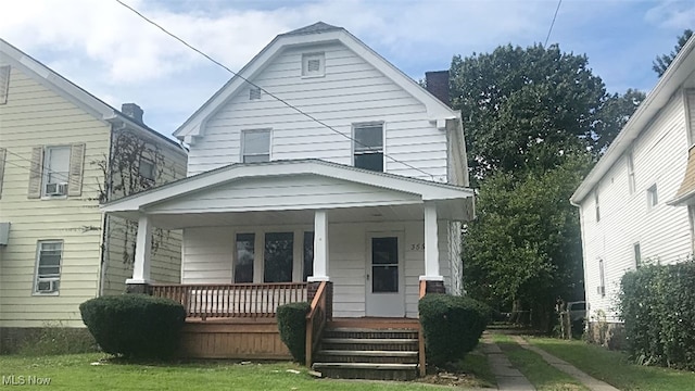 view of front facade with a porch and a front yard